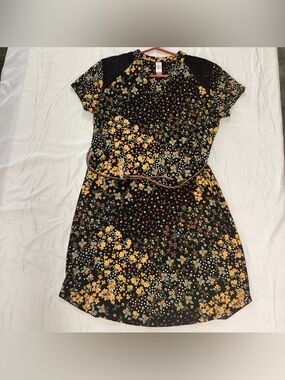 No Boundaries Black Floral Mini Dress braided belt. Lace accents at shoulders